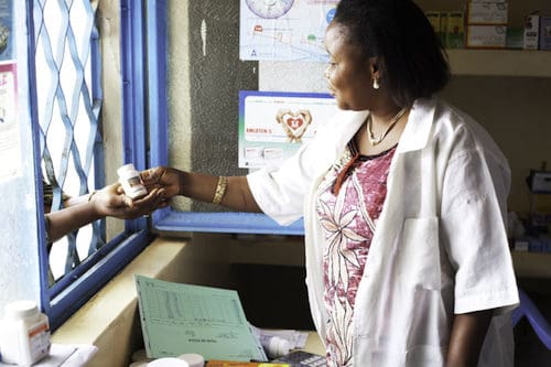 A pharmacist dispenses abacavir sulfate (an anti-retroviral medication).